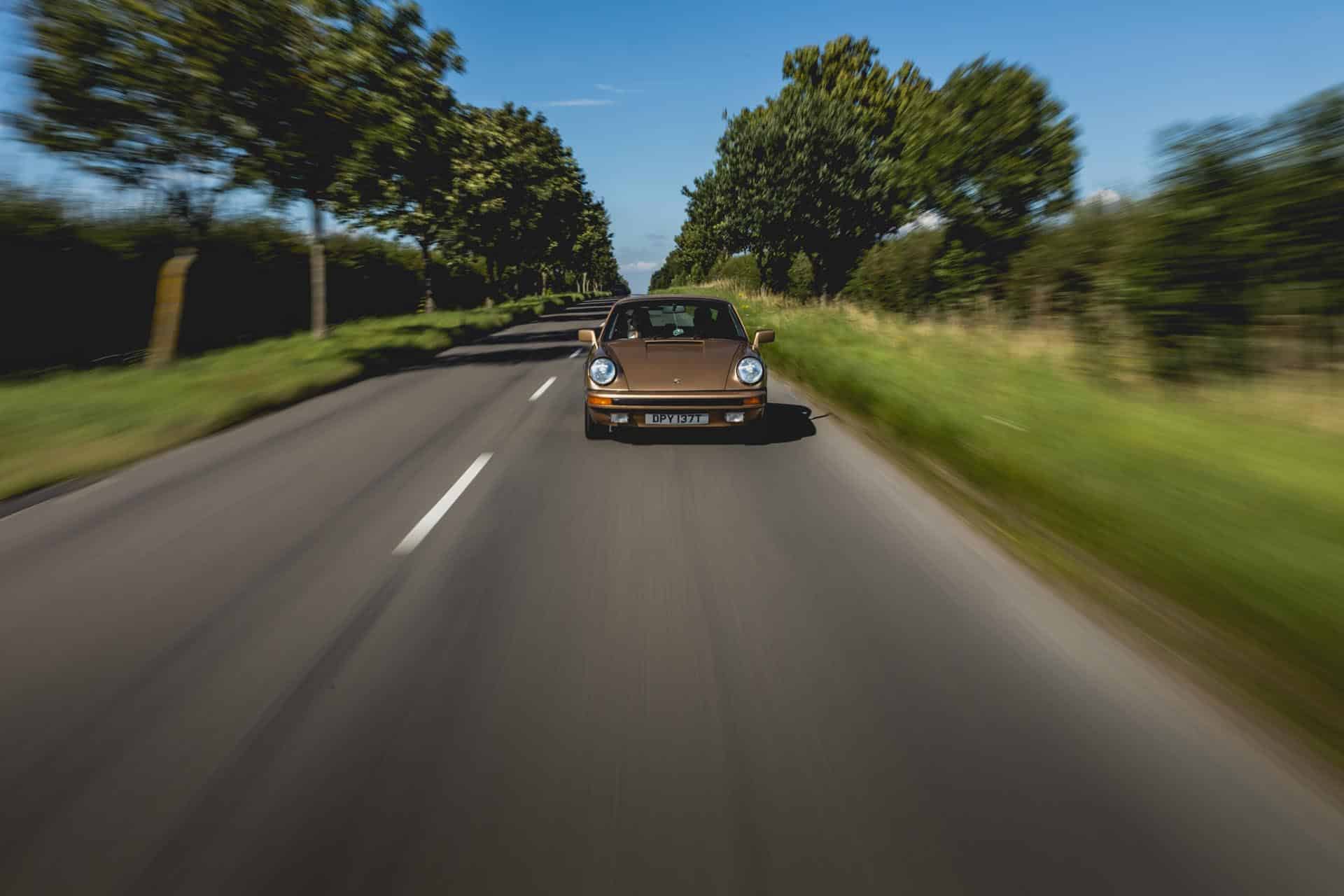 porsche 911 sc on road