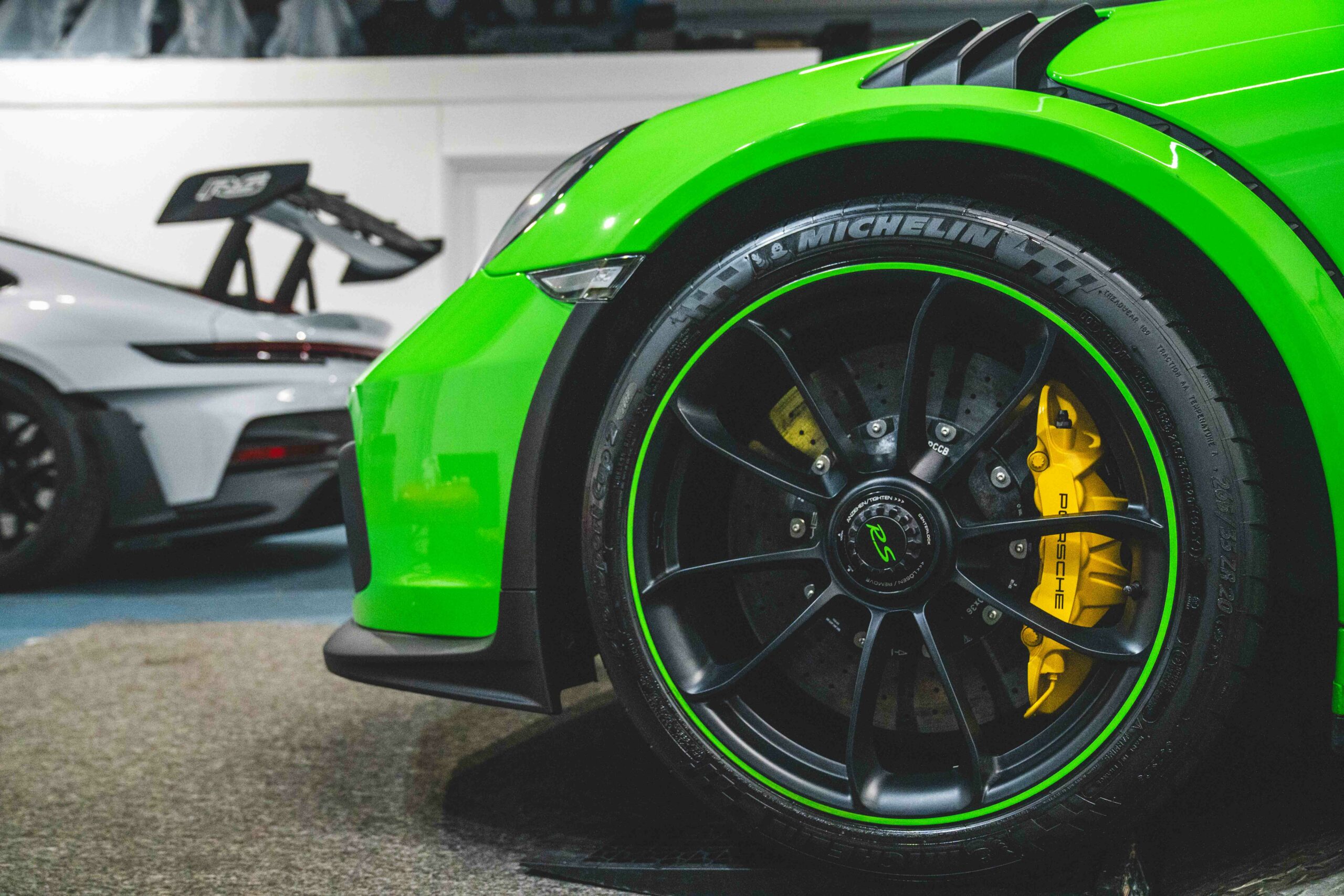 green porsche focused on tyres 
