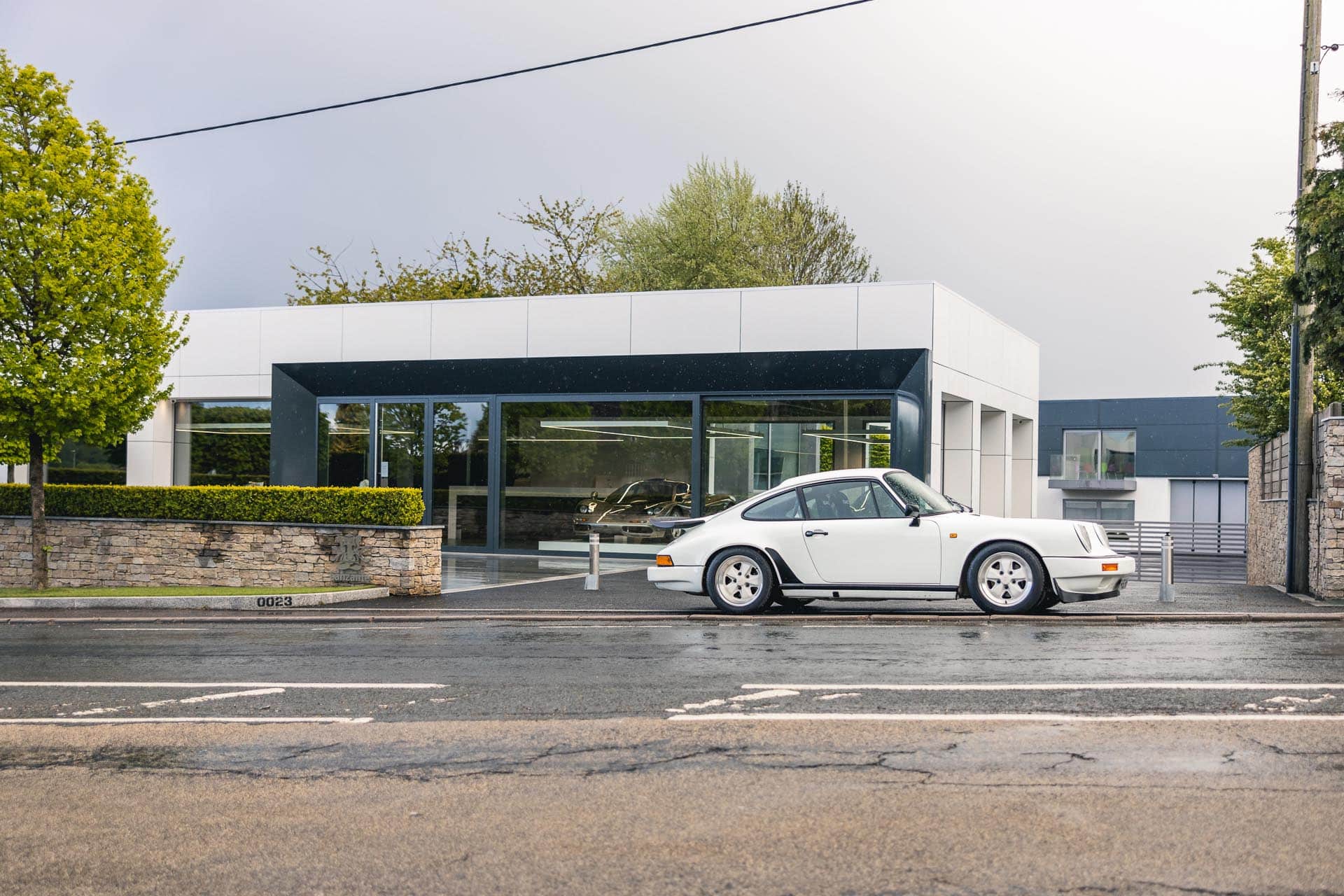 911-3-2-carrera-parked-outside-showroom